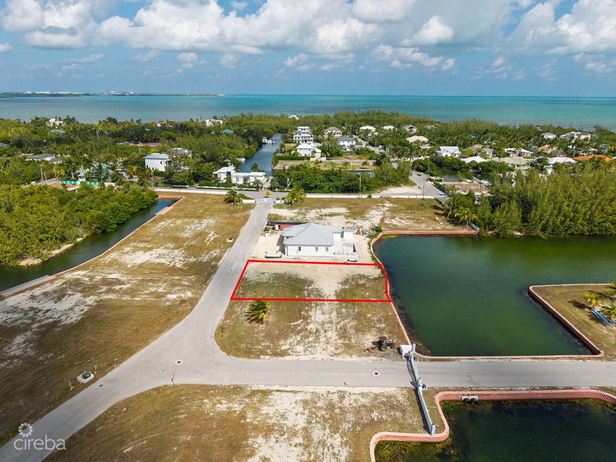 0.24 Acre Canal Lot In Gated Community - Mustique Cove - Image 1