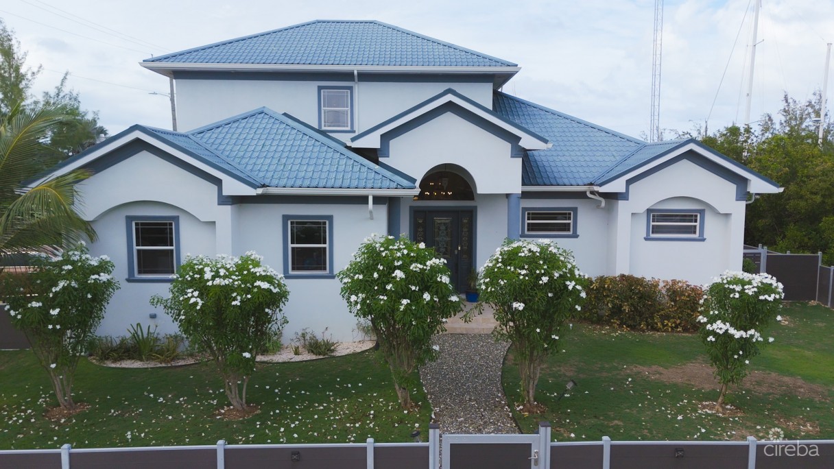 Sun Rose Canal Front Home - North Sound Estates - Image 1